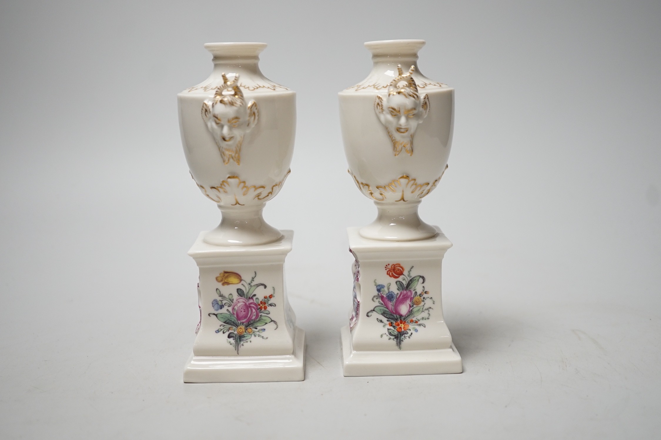 A pair of Nymphenburg urns, marked to base. 15.5cm tall